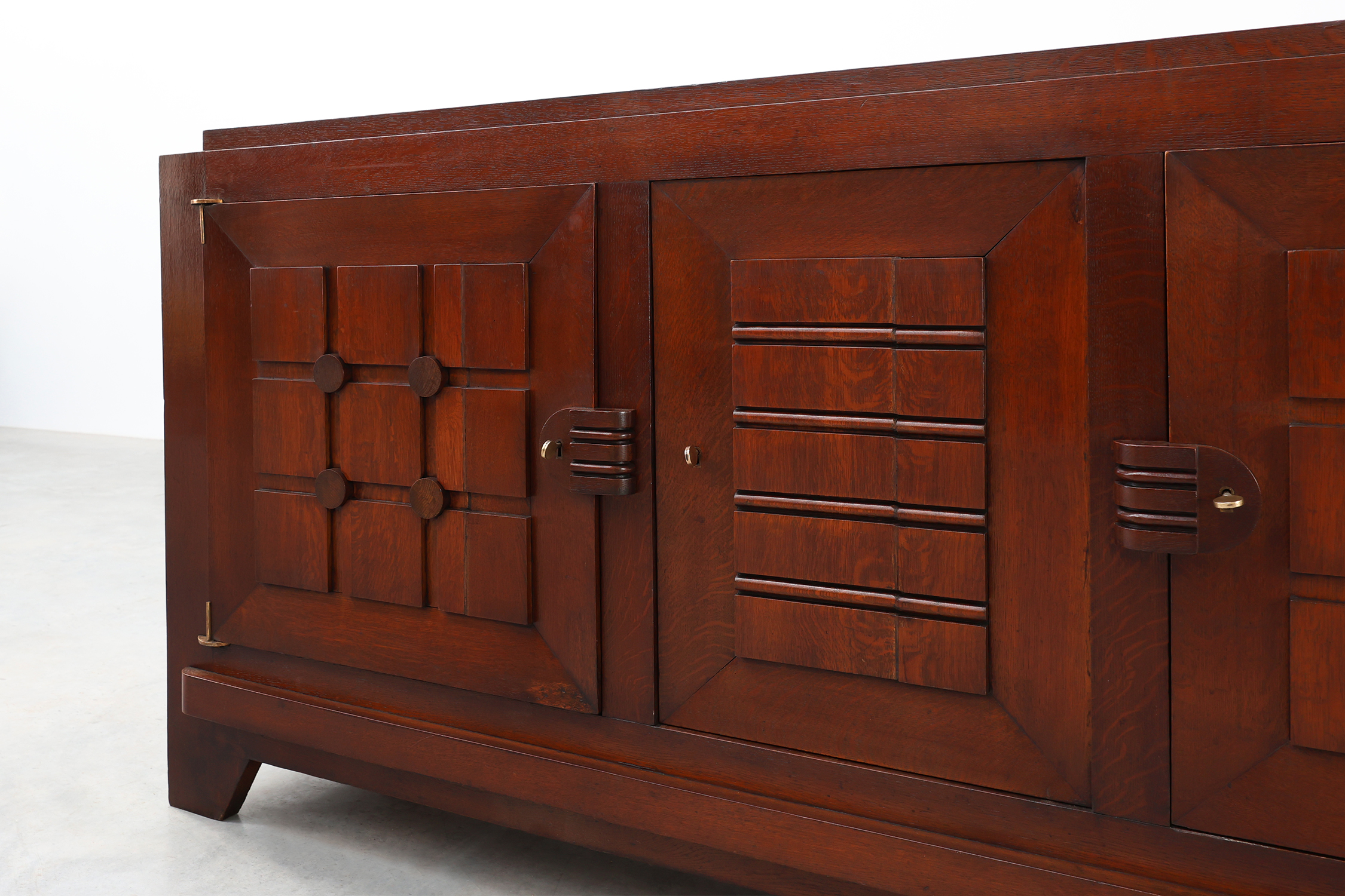 Art Deco carved geometric sideboard by Charles Dudouyt in oak, France ca. 1940thumbnail